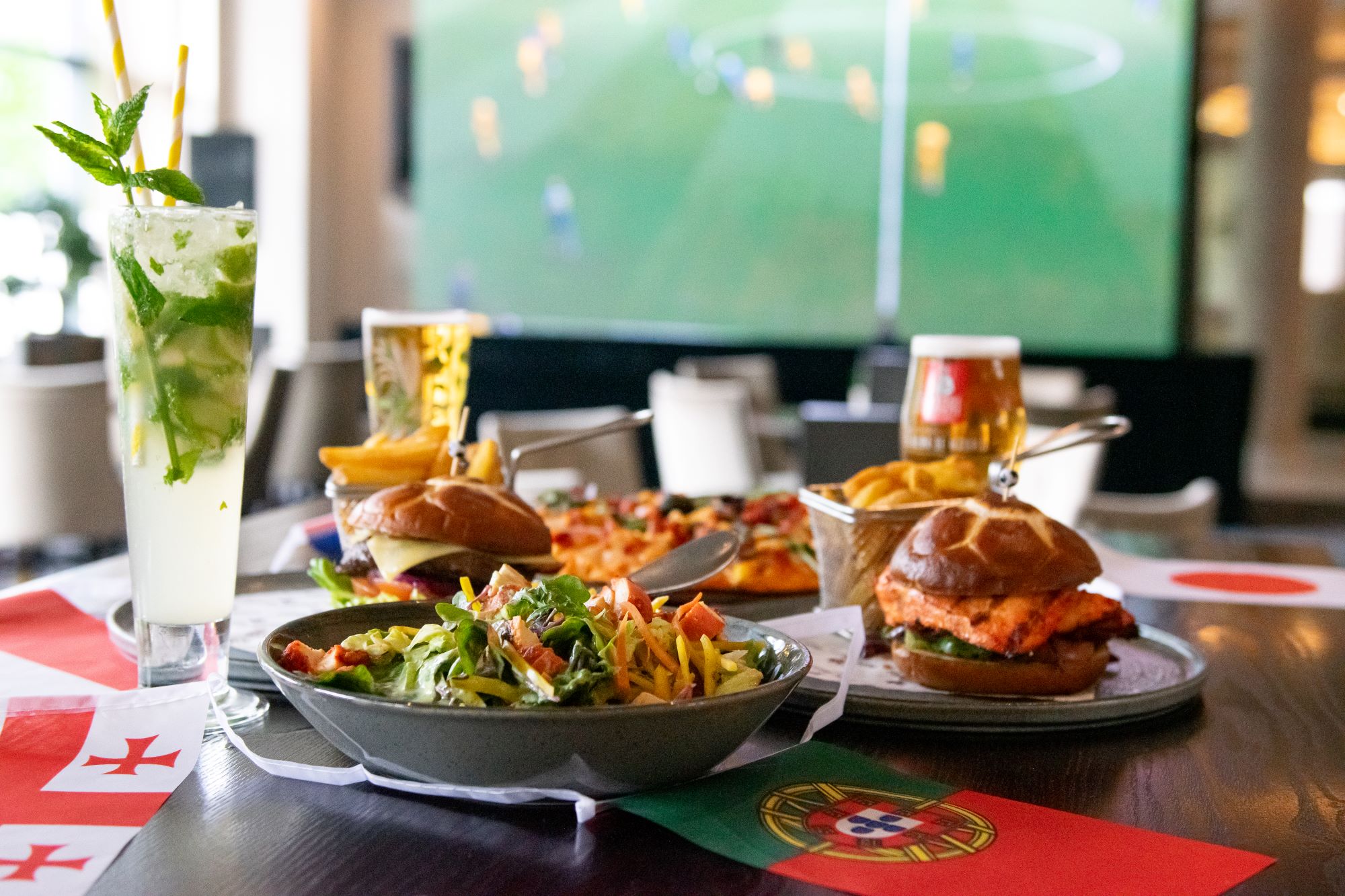 Burger, Salads, and Cocktails on the Table